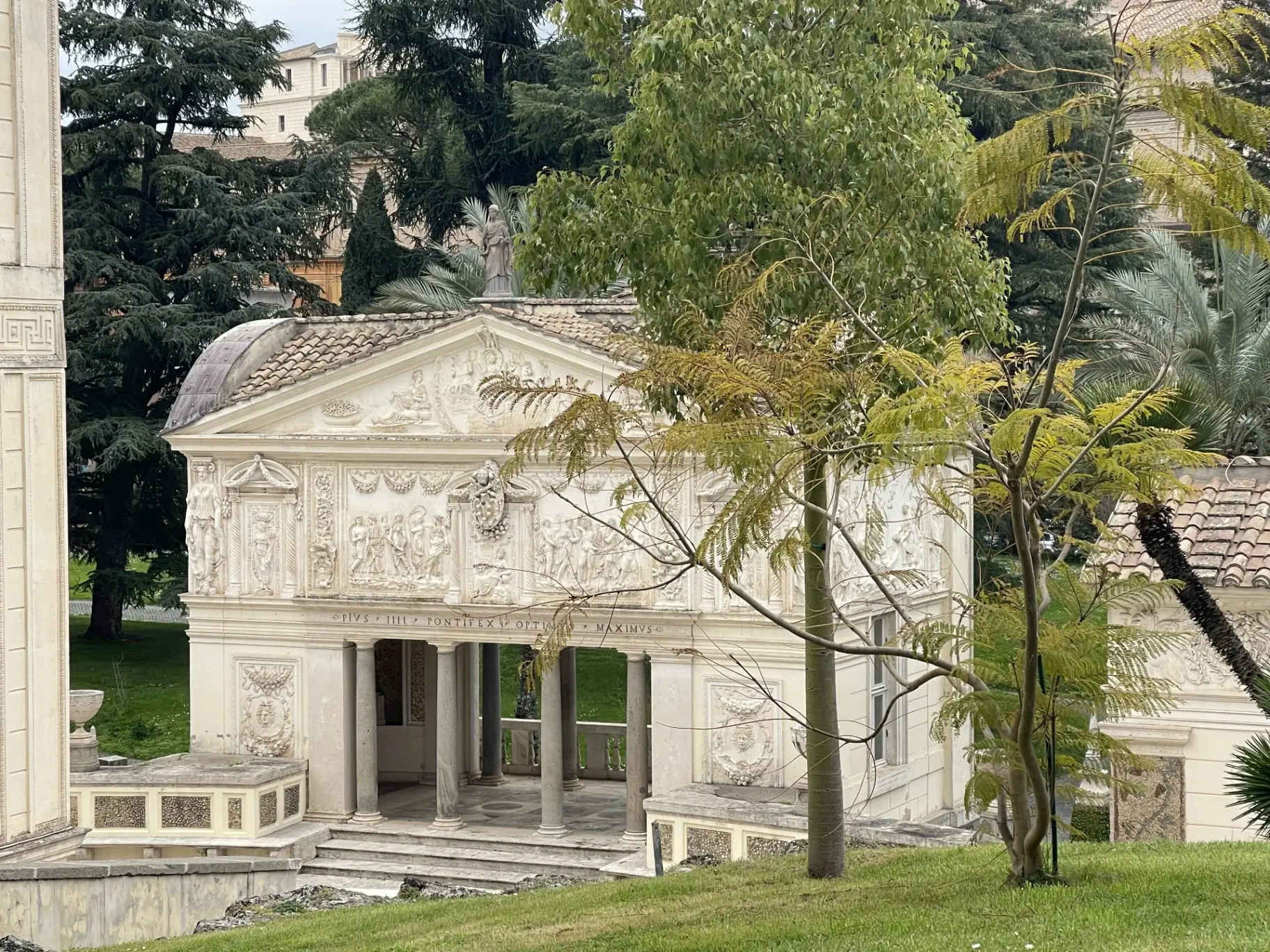 Historic Vatican architecture with ornate columns and relief sculptures